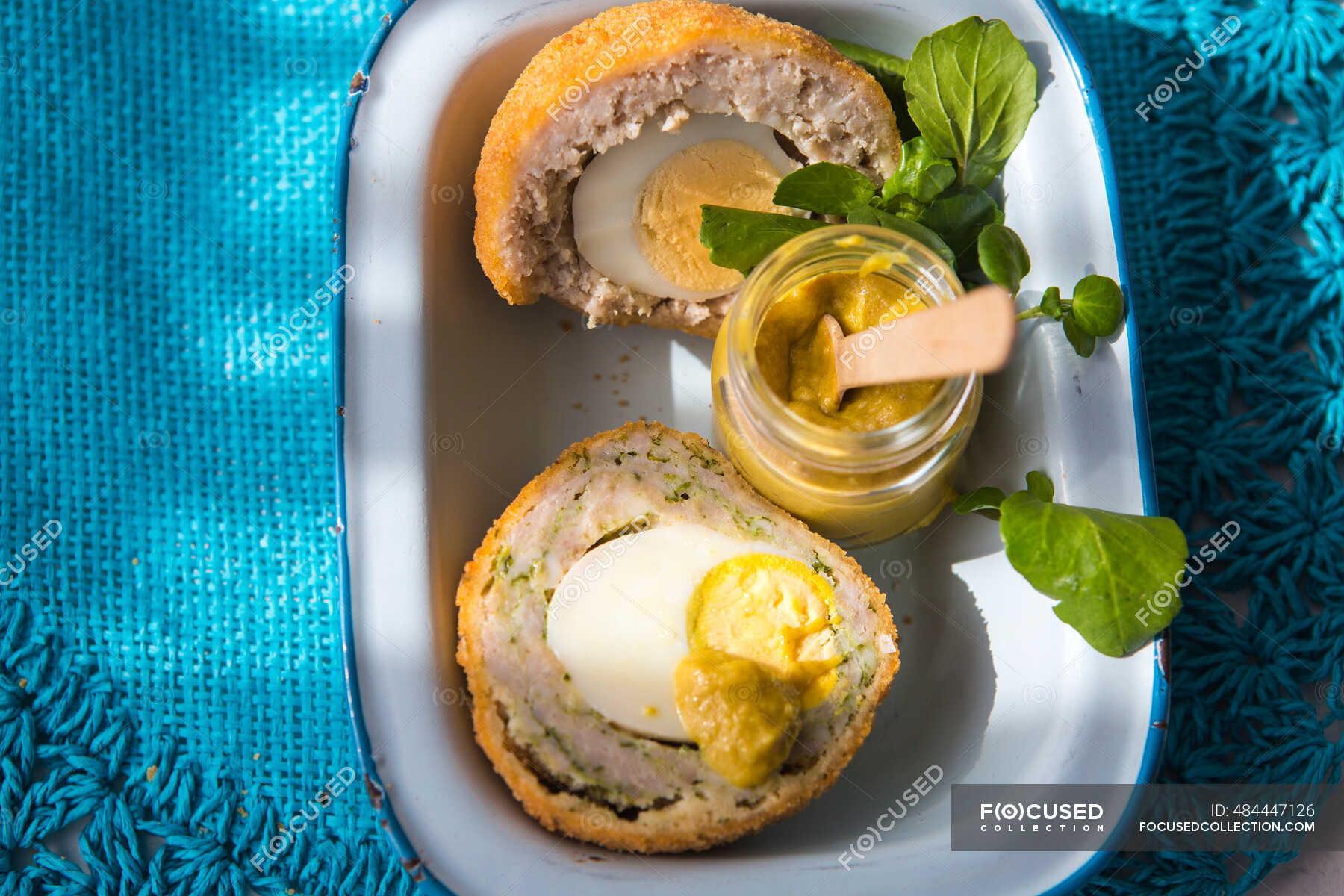 Scotch eggs with mustard — topview, mustard jar Stock Photo 484447126