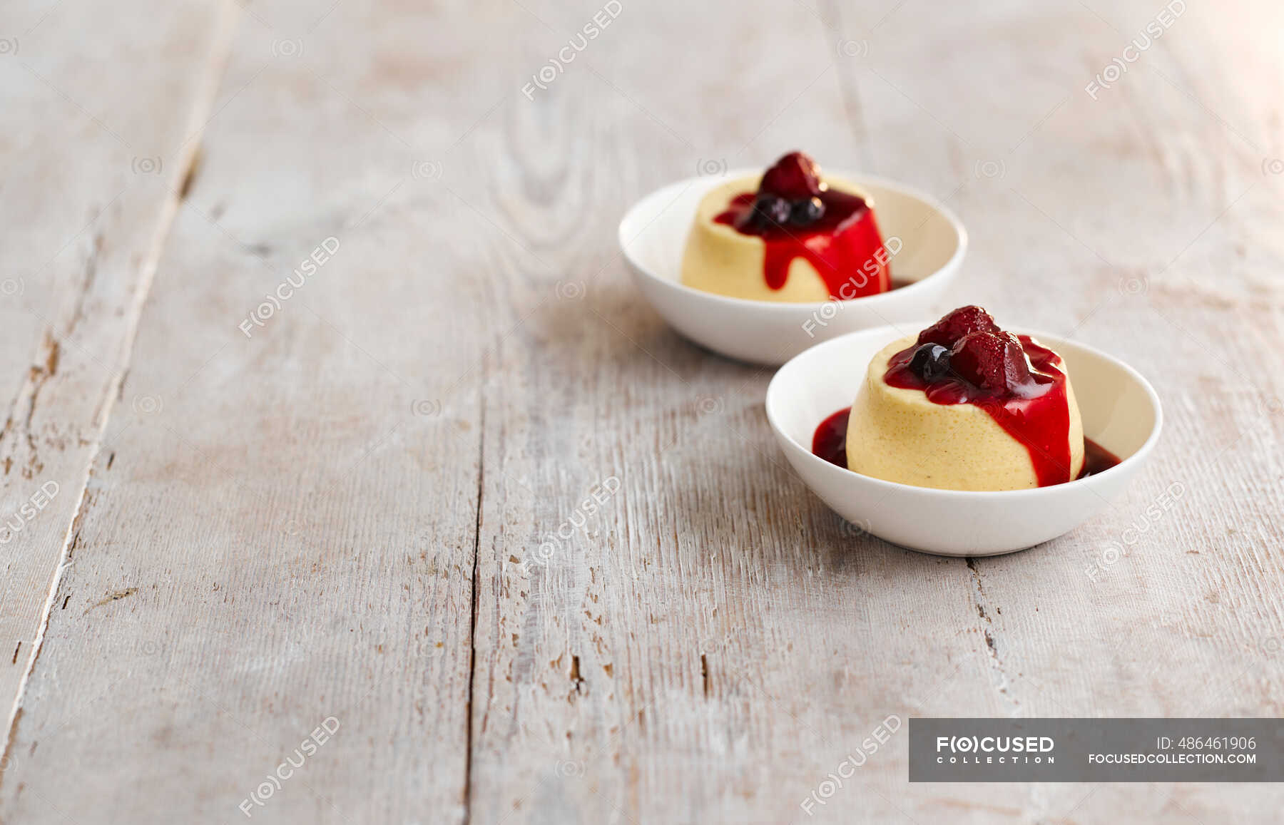 Quaking pudding (oven baked pudding, England) with berry compote