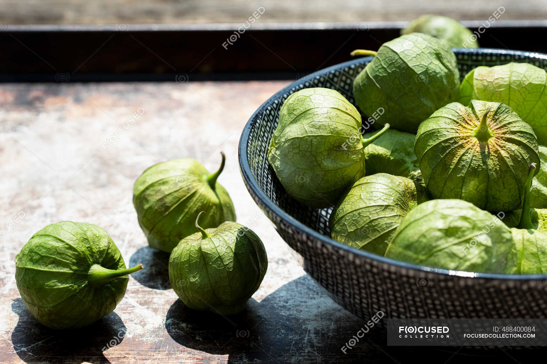 Tomatillos (green tomatoes, Mexico) — uncooked, exotic fruit Stock