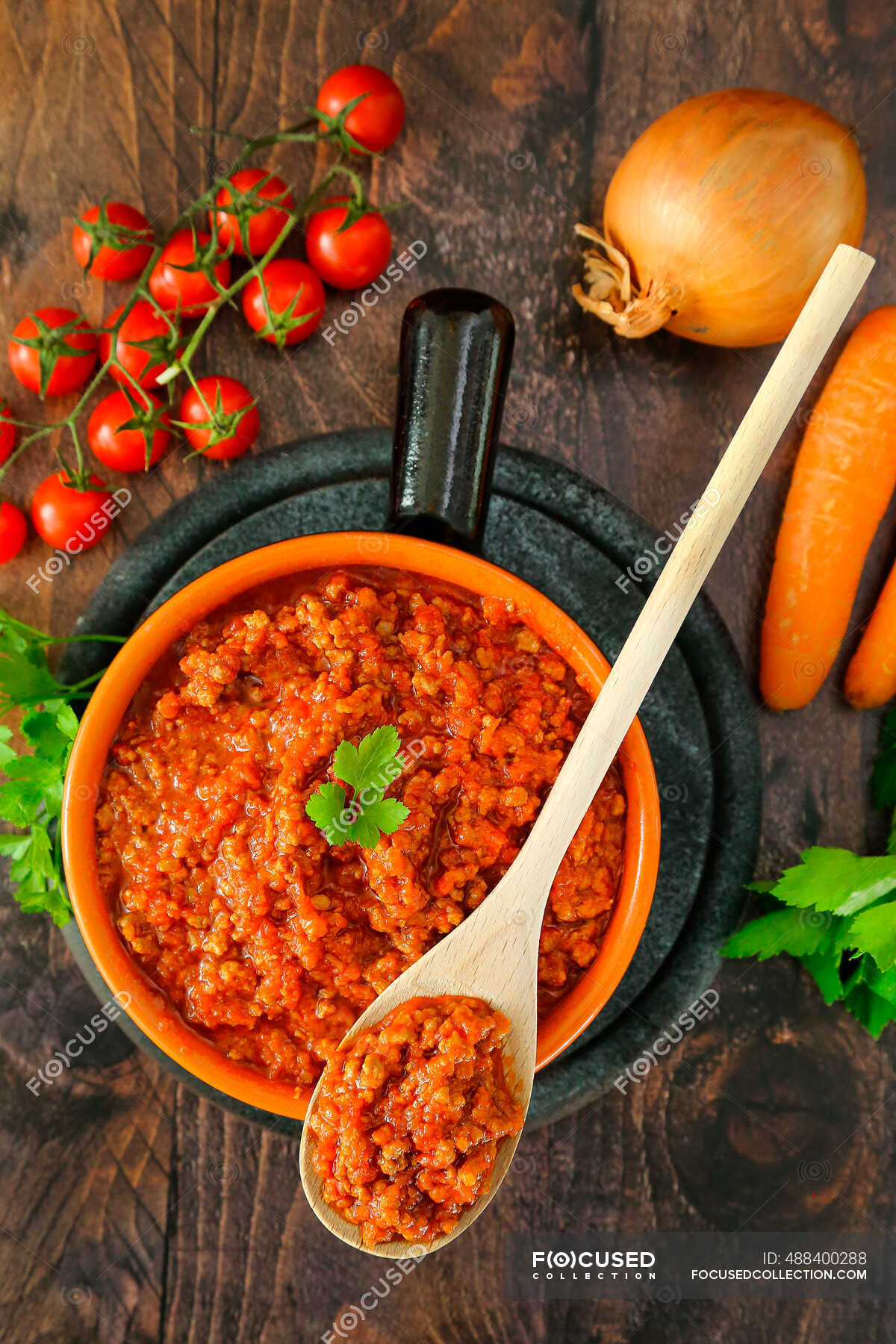 Tomato sauce with spices and herbs — carrots, saucepans Stock Photo