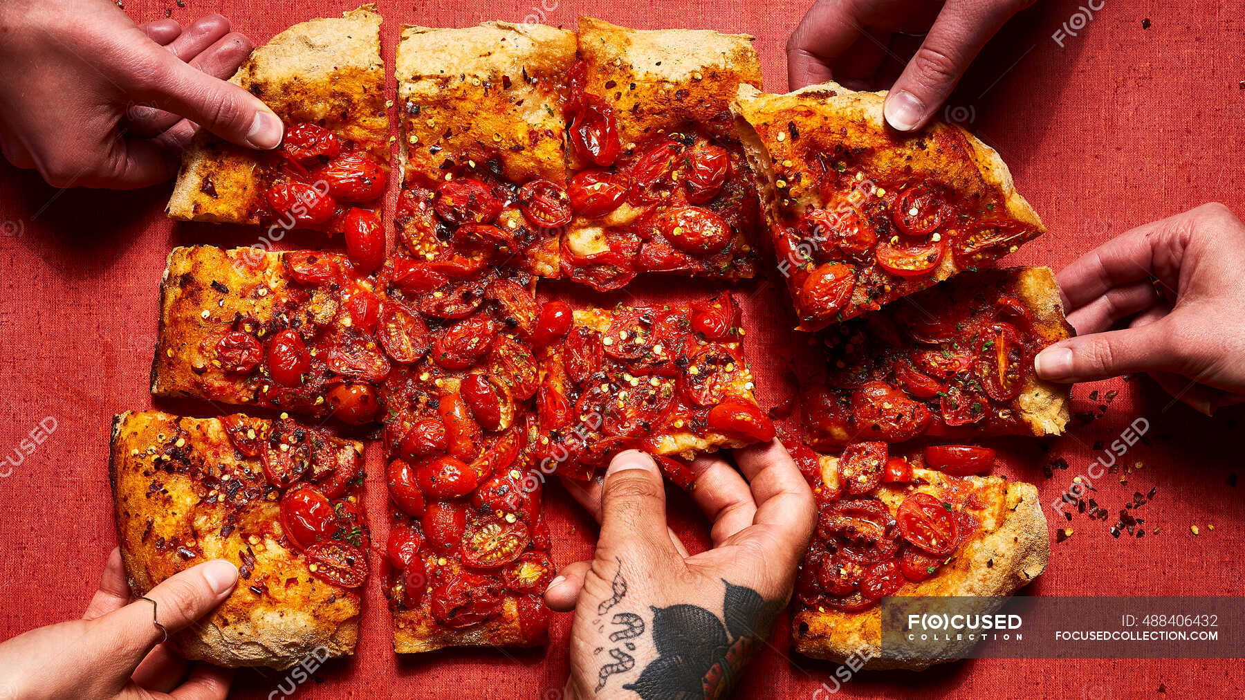 roman-style-pizza-topped-with-tomatoes-and-crushed-red-pepper-flakes