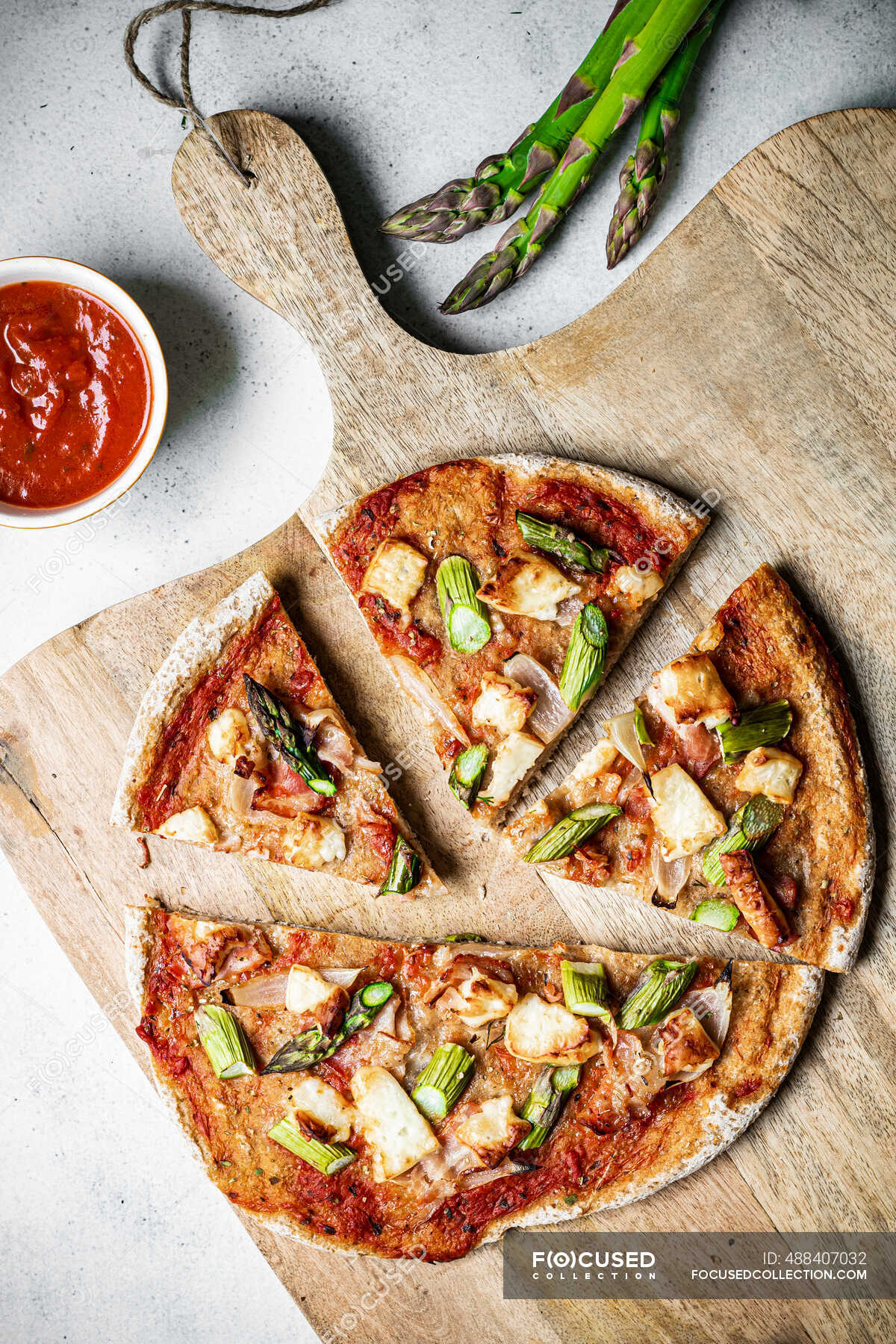 Glutenfree sourdough pizza with asparagus halloumi bacon and tomato