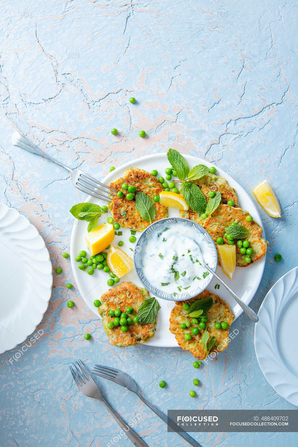 Courgette and pea fritters with lemon and minted yoghurt dip — zucchini ...