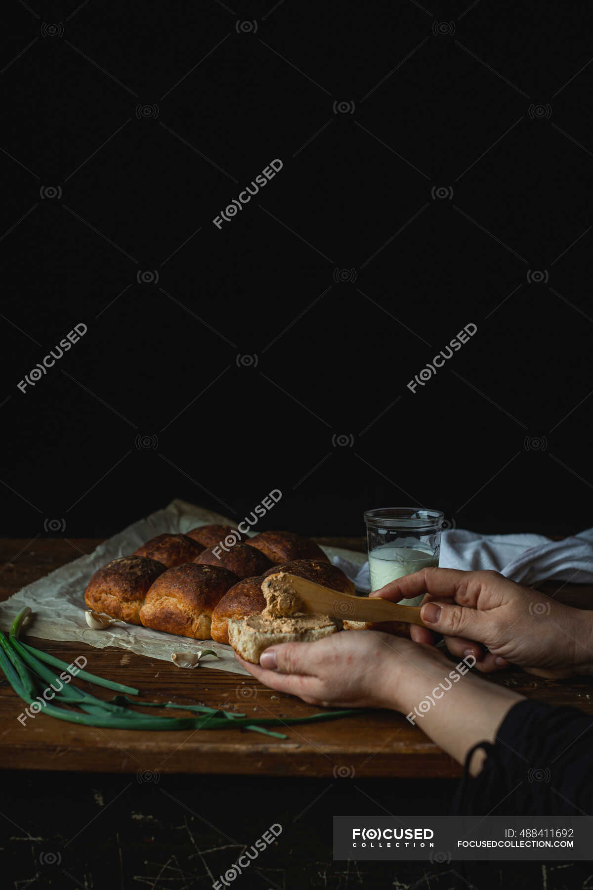 Spreading pate on homemade buns — arrange, bread spread Stock Photo