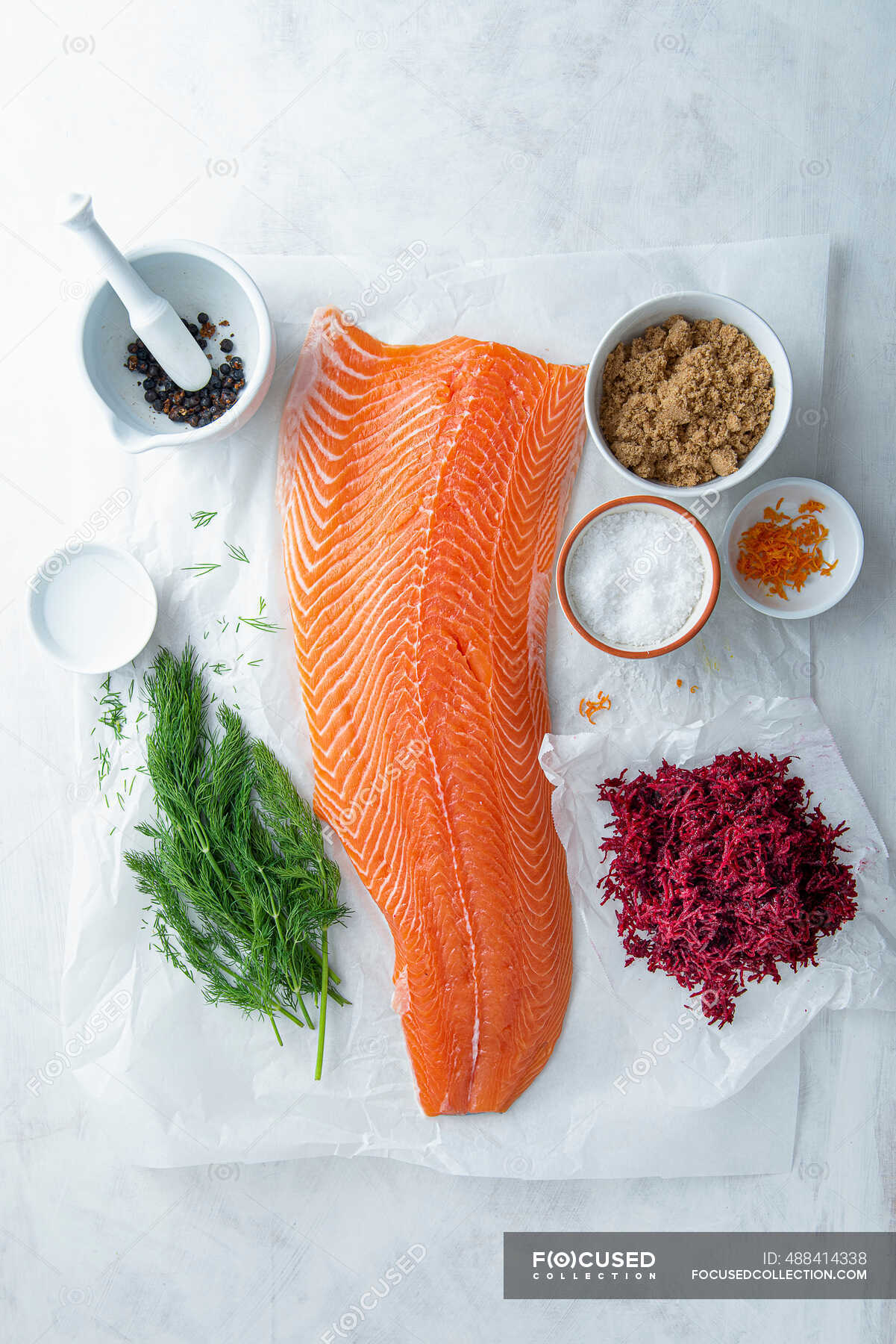 Fillet of salmon and ingredients for beetroot, juniper and gin cured