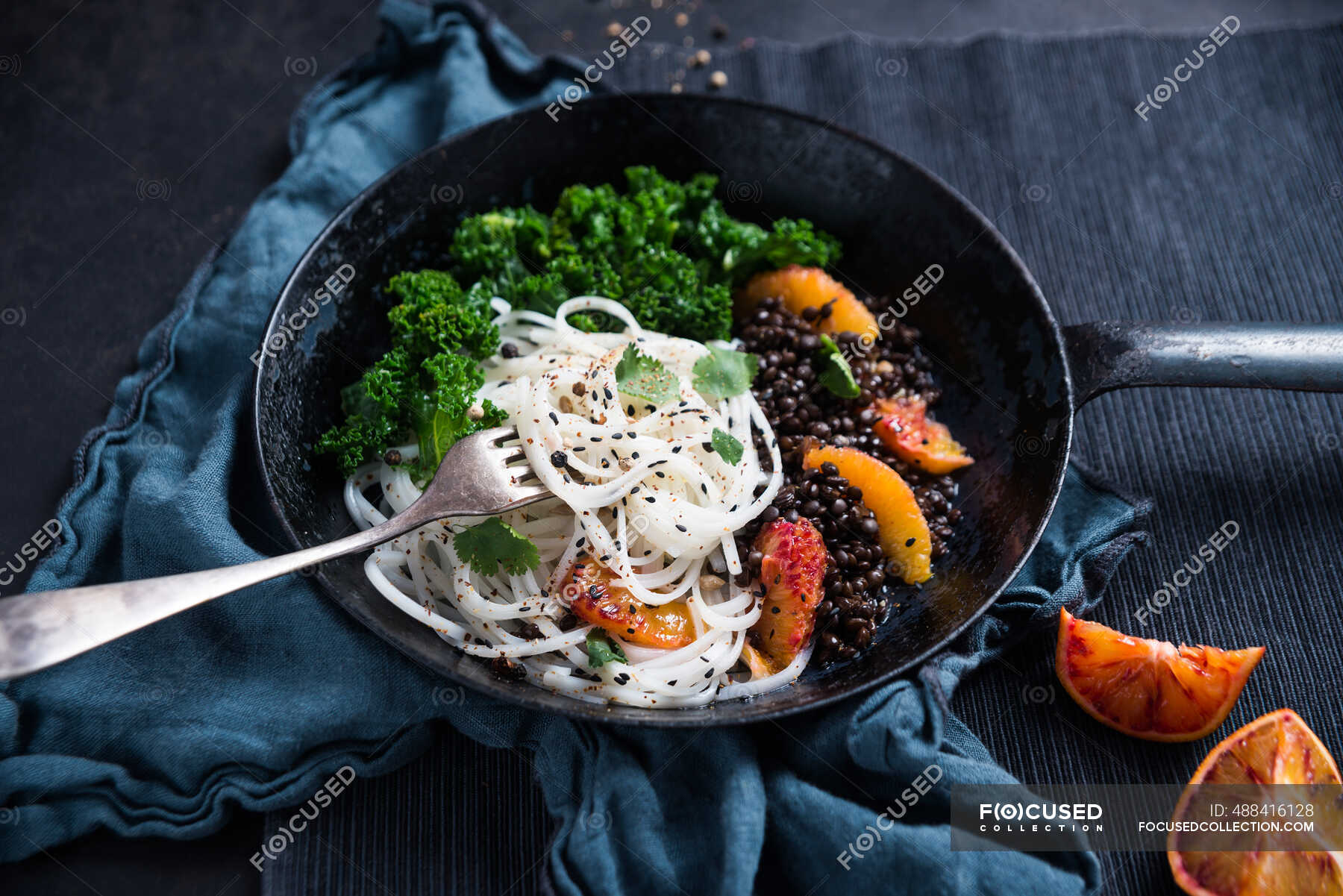 Vegan tapioca pasta with beluga lentils, kale, blood oranges and coriander  — noodle dish, fruit - Stock Photo | #488416128