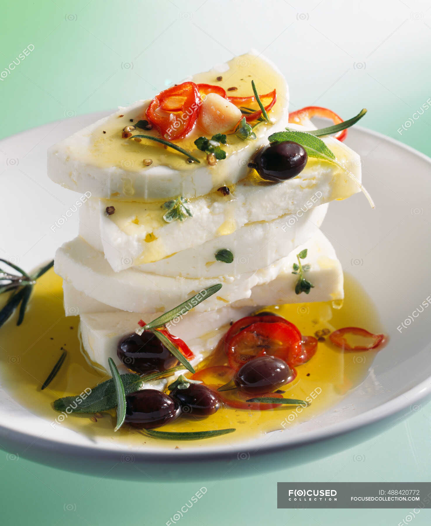 Marinated feta cheese with olive oil, chilli peppers, olives and