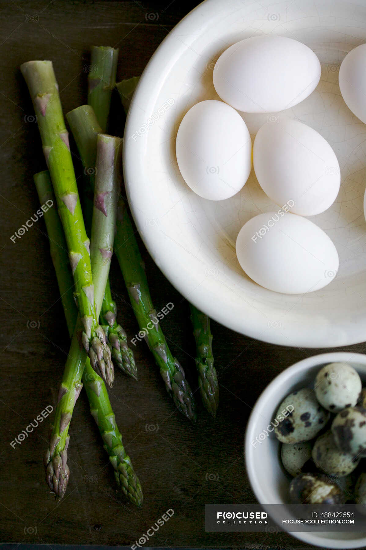 White hens eggs, quails eggs and asparagus still life — quail egg