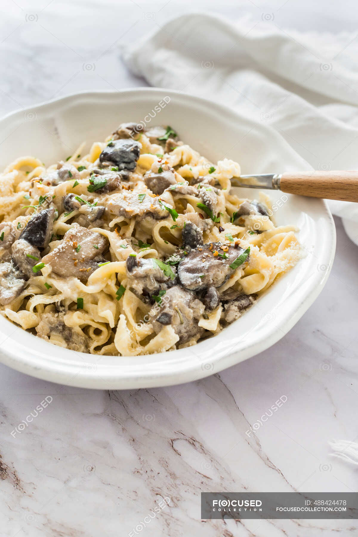 Delicious fettuccine pasta with mushrooms and cream sauce — fungus