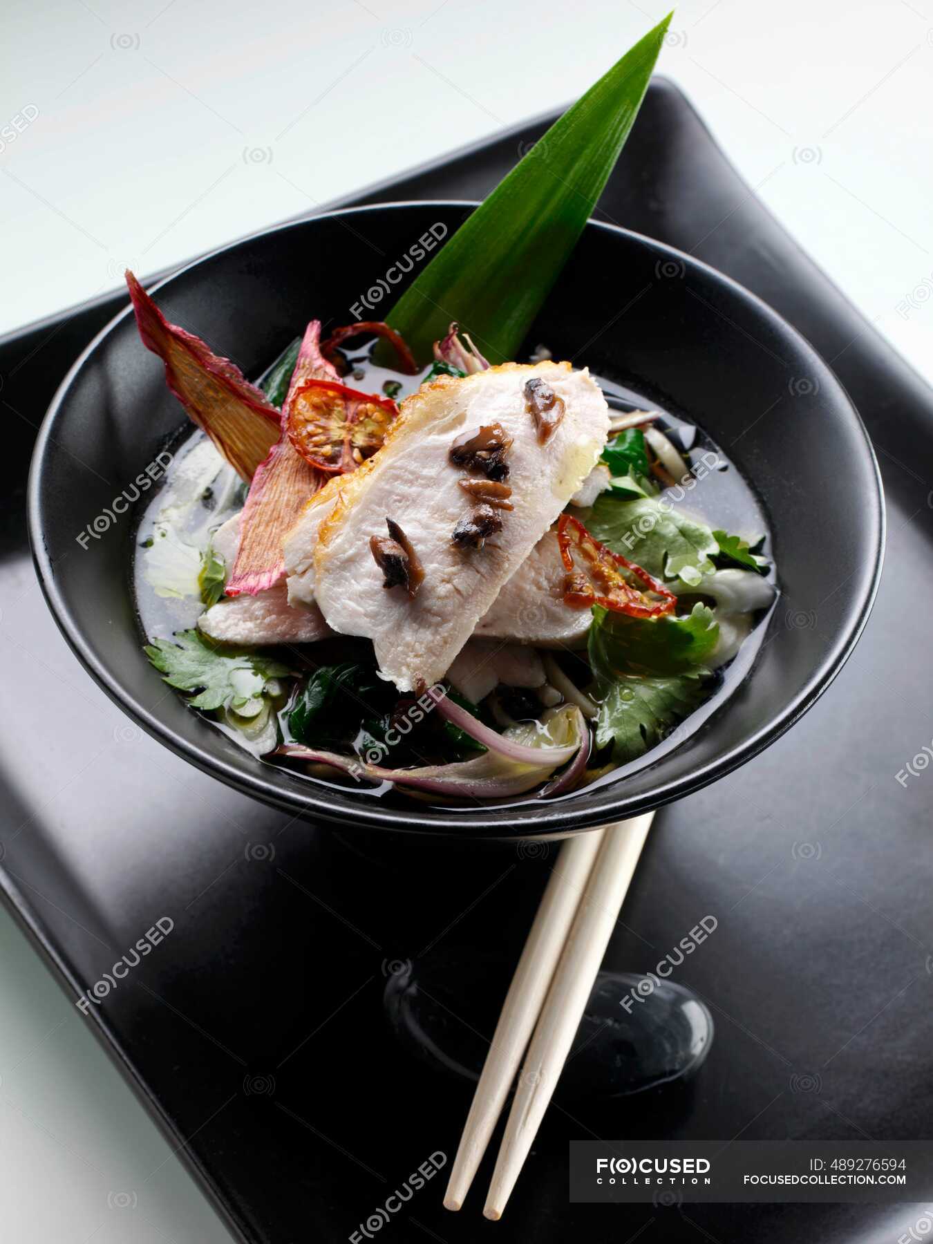 Seared chicken with soba and mushroom noodles in green tea broth — gourmet, nutrition Stock