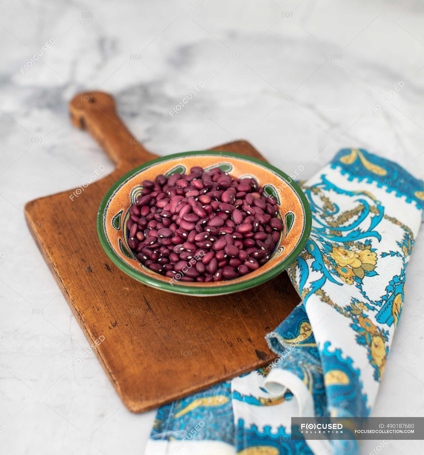Red beans in a bowl on a wooden background — vegan, leguminosae Stock Photo 490187680