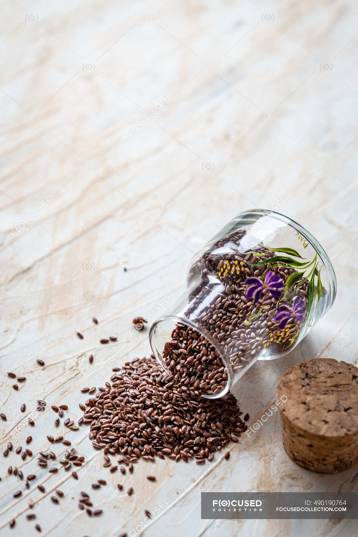 Glass of flax seeds on wooden background — brown, natural - Stock Photo |  #490190764