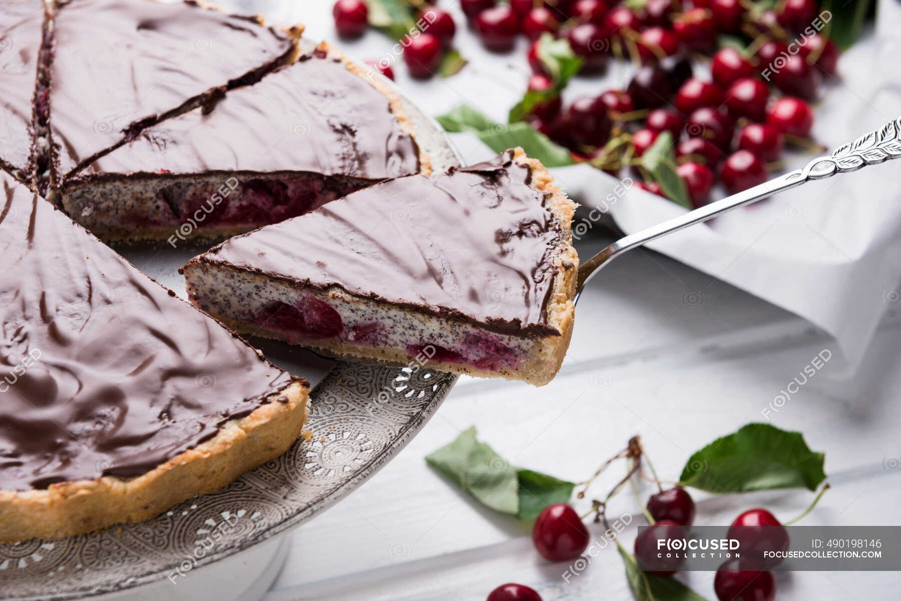Vegan poppyseed and quark cake with sweet cherries and dark chocolate