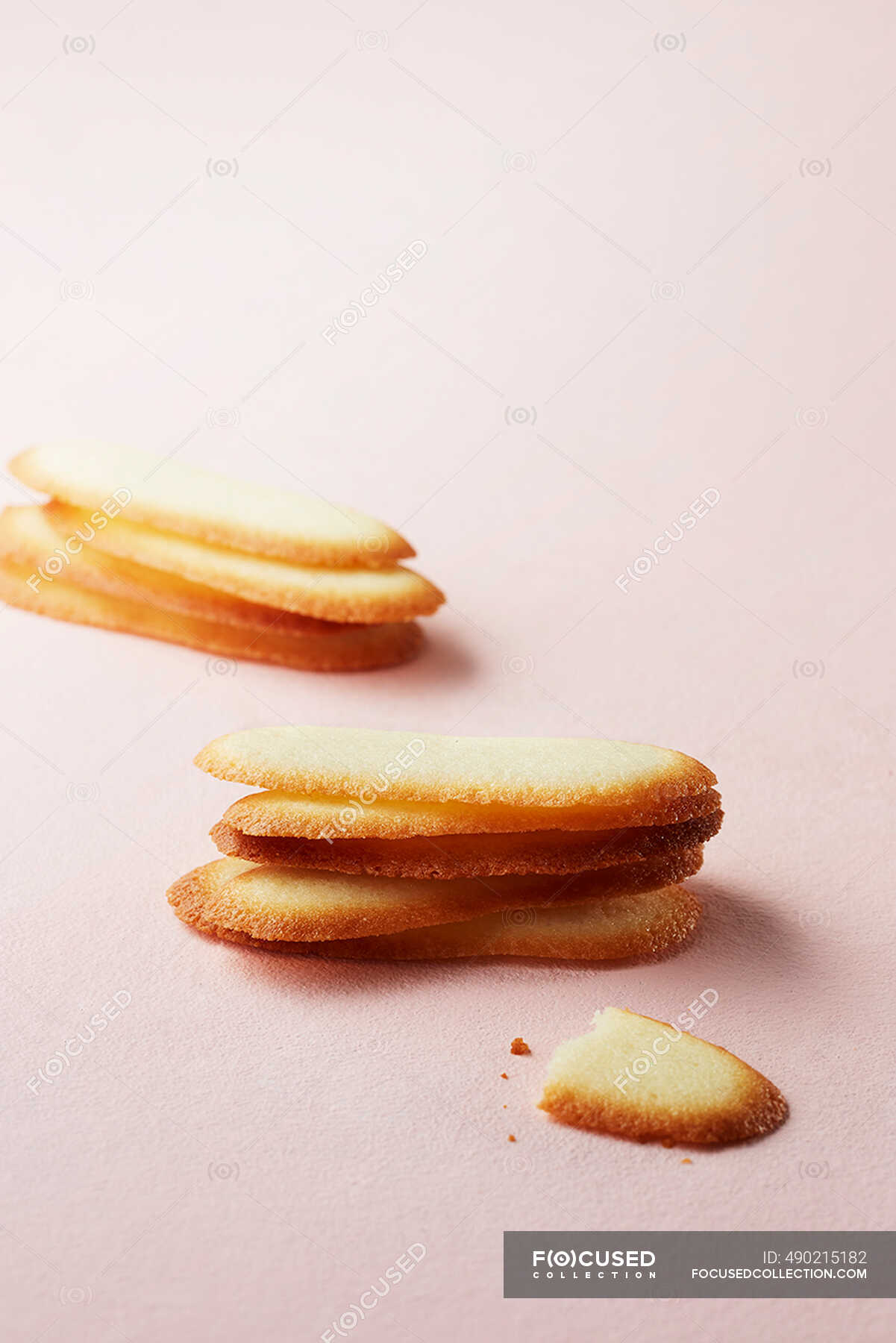Cat's tongue biscuits — sweet, coffee dish Stock Photo 490215182