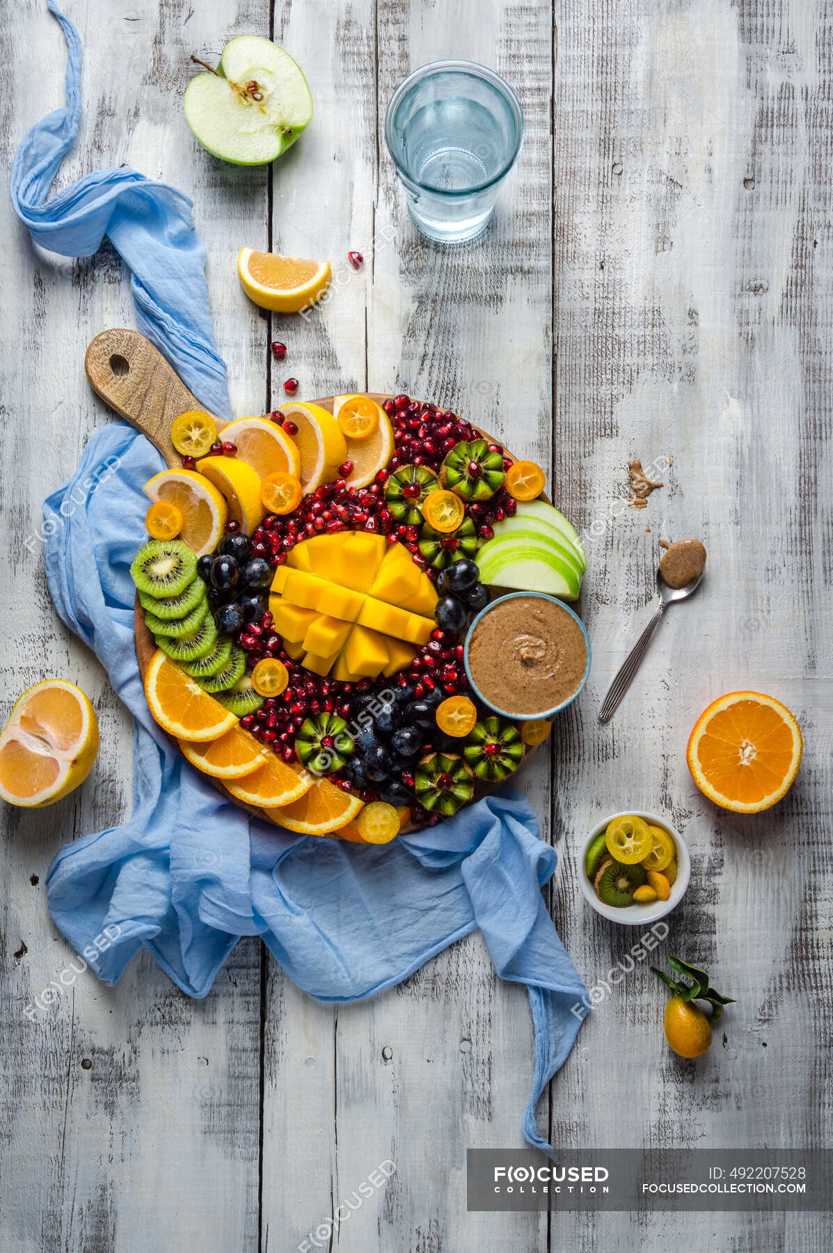 Fresh winter fruit platter with mango, oranges, kiwi, kumkquat