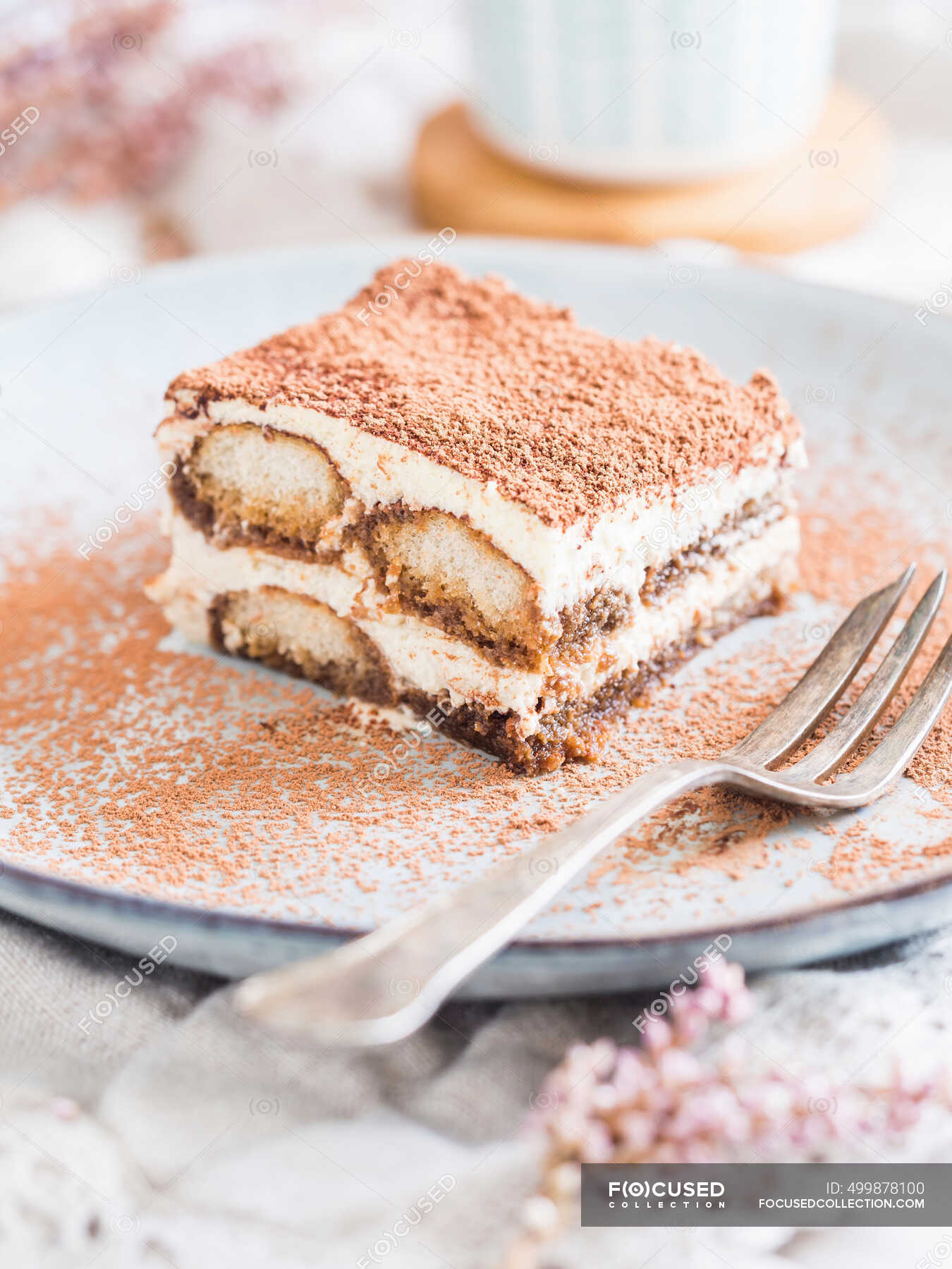 Piece of homemade tiramisu with fork, close up shot — breakfast