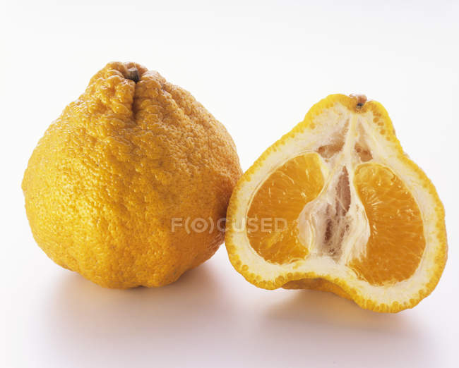 Whole and Halved Ugli Fruit — Stock Photo