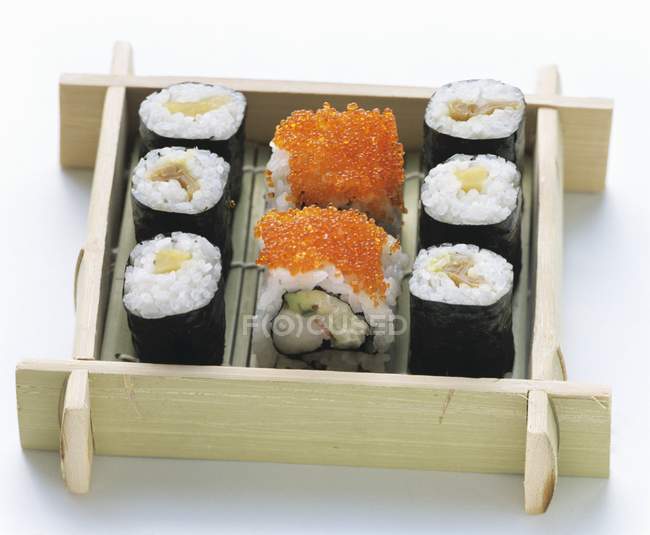 Assorted Sushi in wooden box — Stock Photo