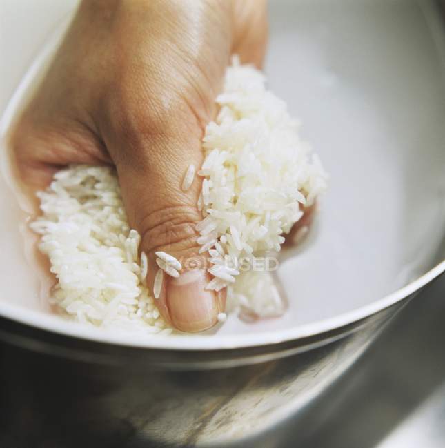 Rice being rinsed — Stock Photo