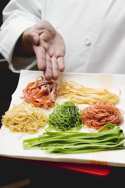 Plate of coloured pasta — Stock Photo
