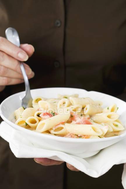 Penne pasta with salmon in bowl — Stock Photo