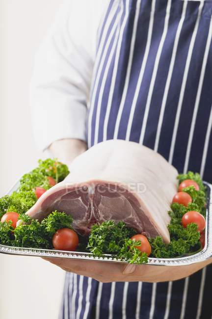 Saddle of lamb in hands — Stock Photo