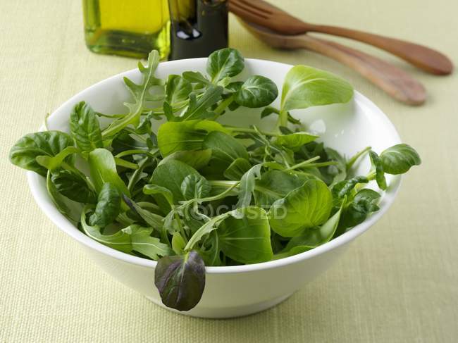 Corn salad and rocket in bowl — Stock Photo