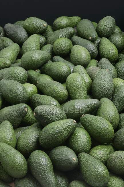 Heap of fresh avocados — Stock Photo
