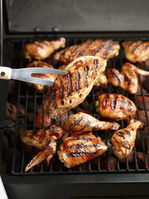 Chicken pieces on barbecue — Stock Photo