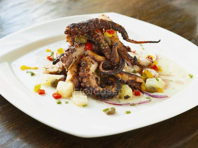 Salad with barbecued Octopus — Stock Photo