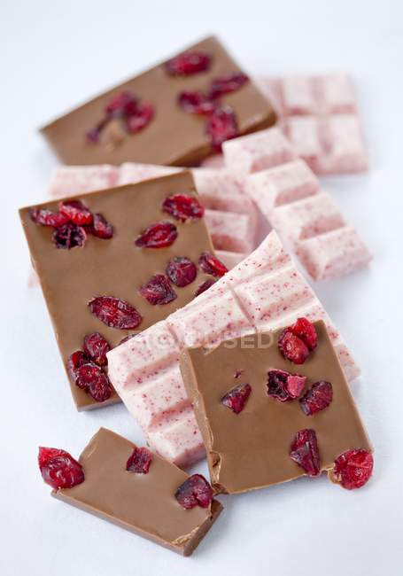 Pieces of chocolate with cranberries — Stock Photo