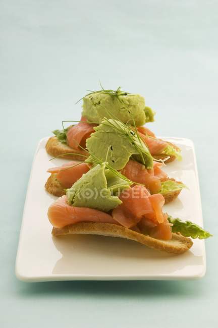 Canapes with avocado sorbet — Stock Photo