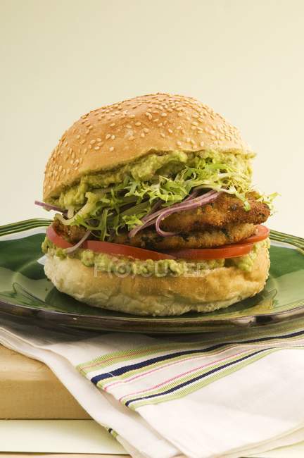 Pork escalope burger with guacamole — Stock Photo