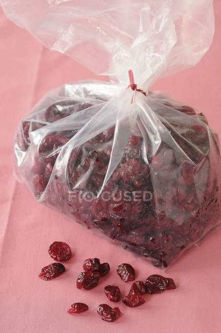 Dried cranberries in plastic bag — Stock Photo