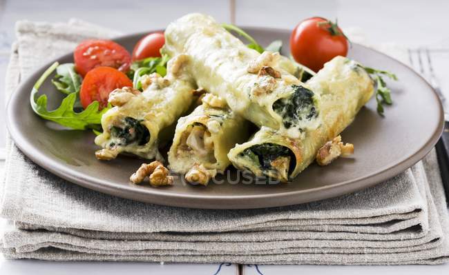 Cannelloni pasta filled with spinach — Stock Photo