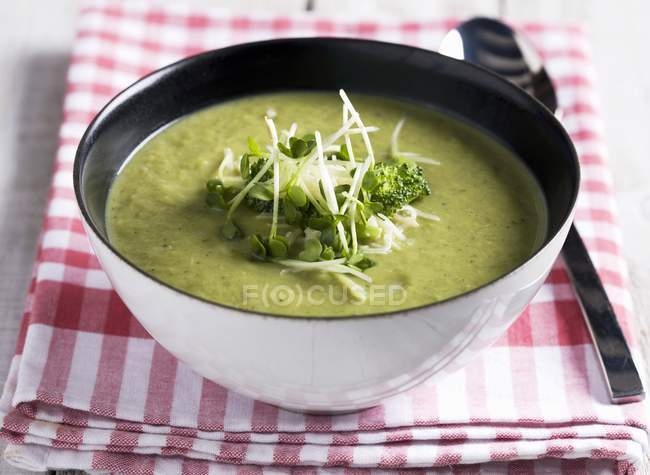 Broccoli soup with cress in bowl — Stock Photo