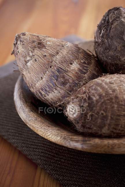 Malanga roots in a wooden bowl — Stock Photo