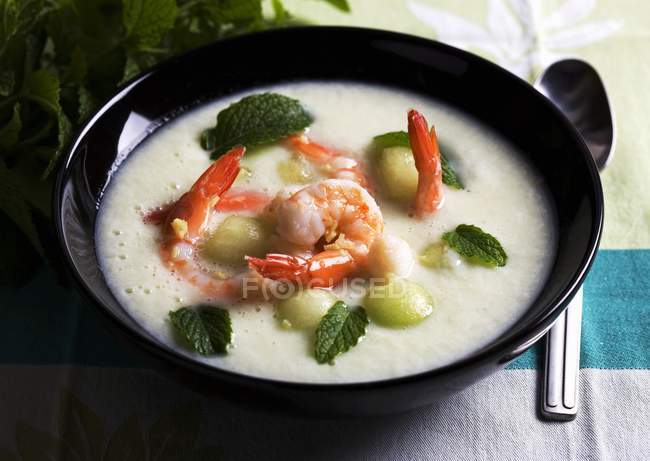 Cold melon soup with prawns — Stock Photo