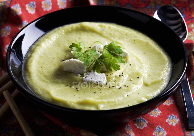Pumpkin soup with goats cheese — Stock Photo