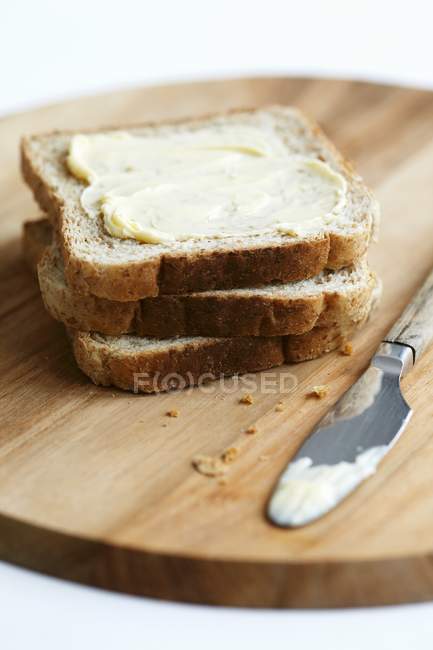 Tranches de pain au beurre — Photo de stock