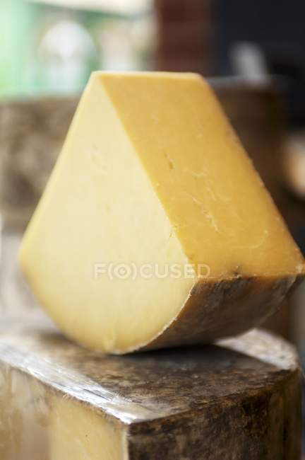 Piece of Cheddar cheese — Stock Photo
