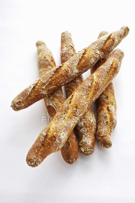 Rye baguettes in heap — Stock Photo