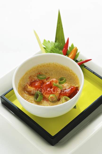 Closeup view of steamed egg with spicy Szechaun prawns, vegetables and herbs — Stock Photo