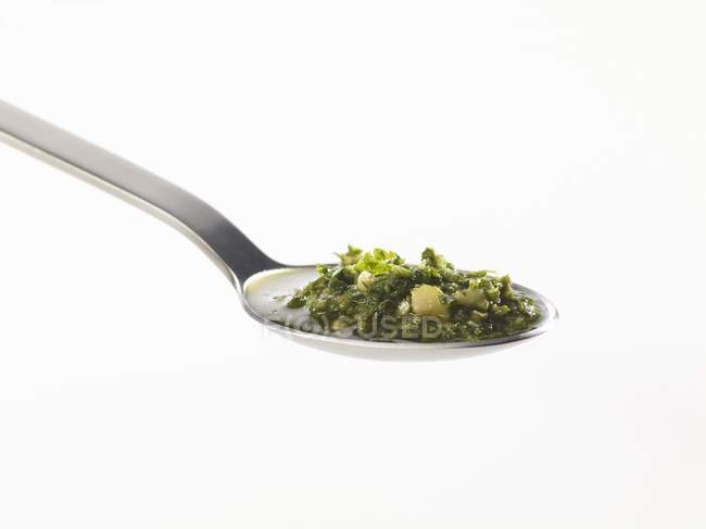 Spoonful of tasty pesto — Stock Photo