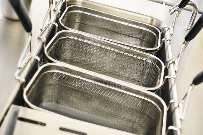 Elevated view of deep fryers in water — Stock Photo