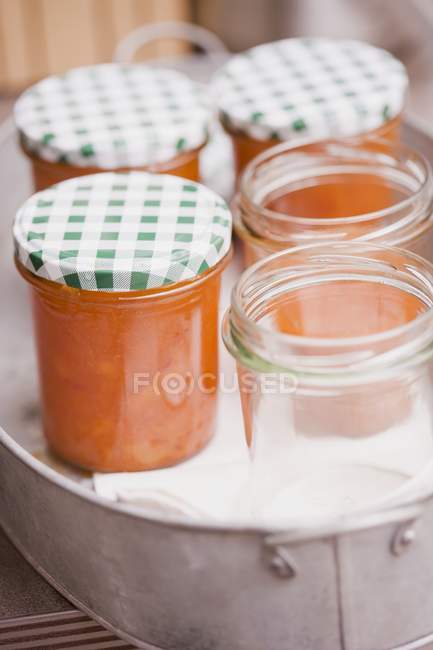 Apricot jam in jars — Stock Photo