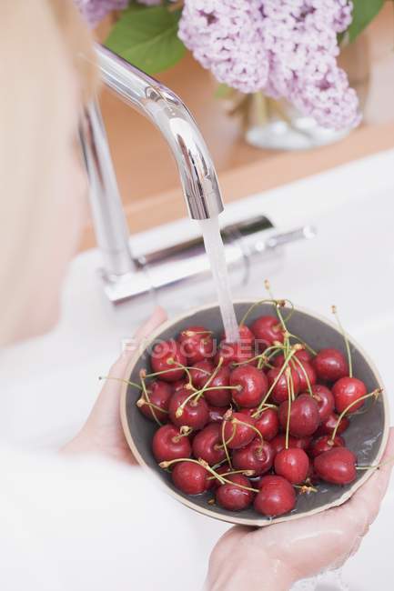 Cherries being washed — Stock Photo
