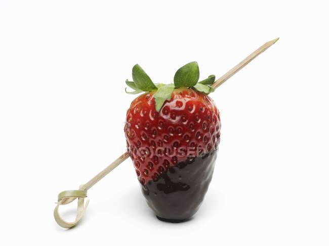 Chocolate strawberry on a kebab stick — Stock Photo