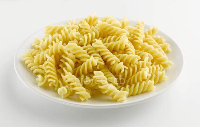 Plate of cooked fusilli — Stock Photo