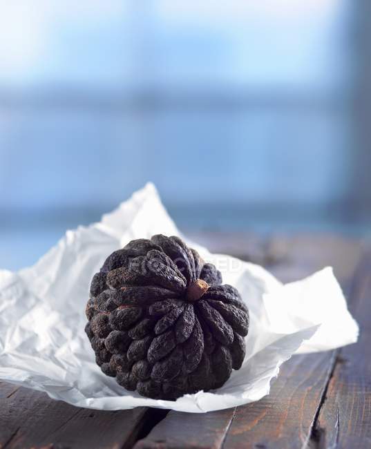 Sweetsop On Paper over table — Stock Photo